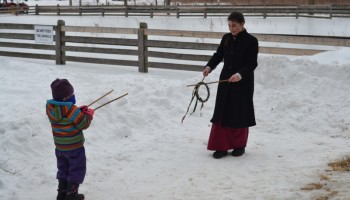 staff playing victorian games with kids