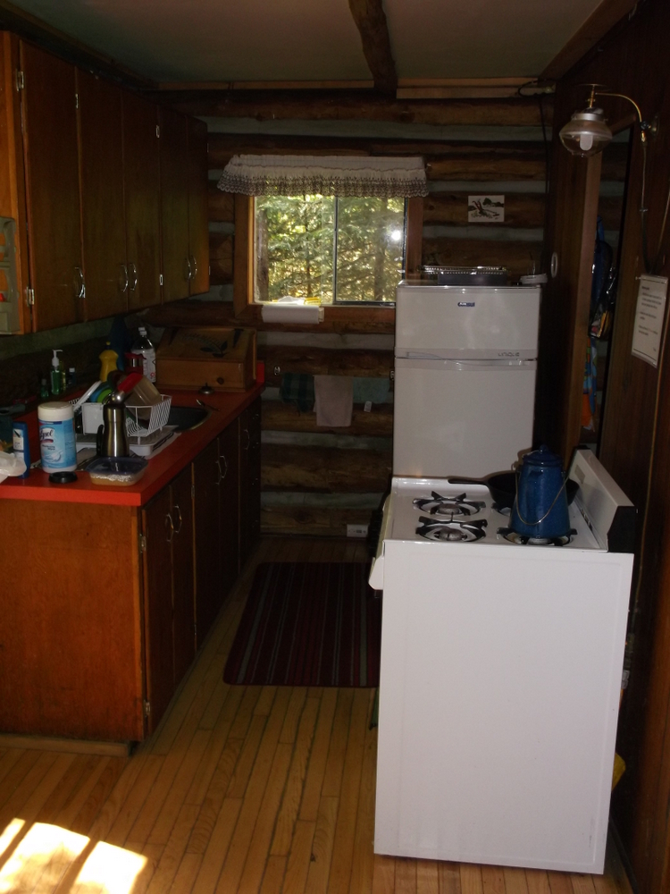 rain lake ranger cabin kitchen